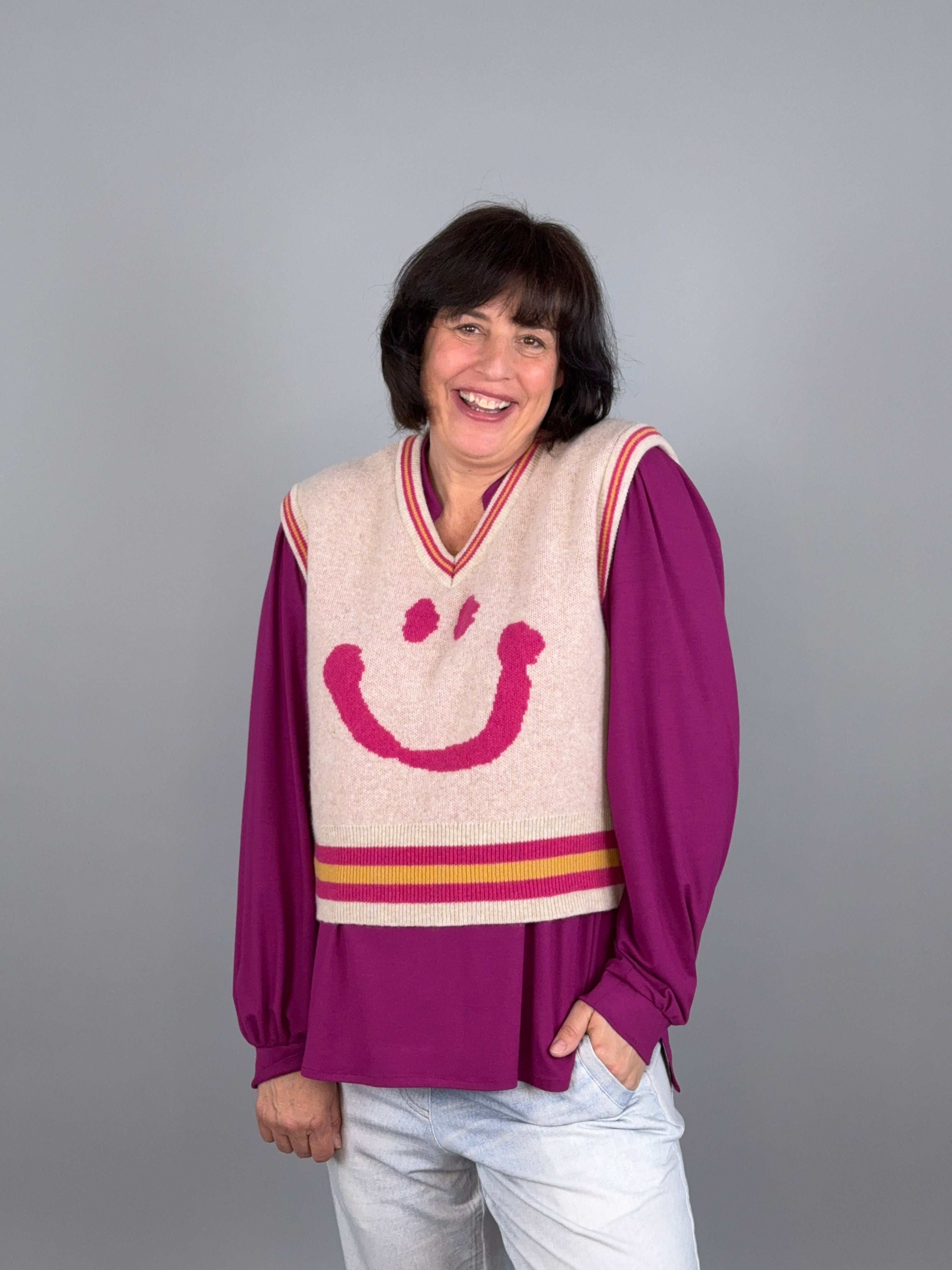 Smiley -der Pullunder mit dem Lächeln in beige/pink aus 100% Merinowol ...